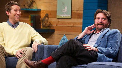 Zach Galifianakis Wears a Blue Jacket & Red Socks Summary